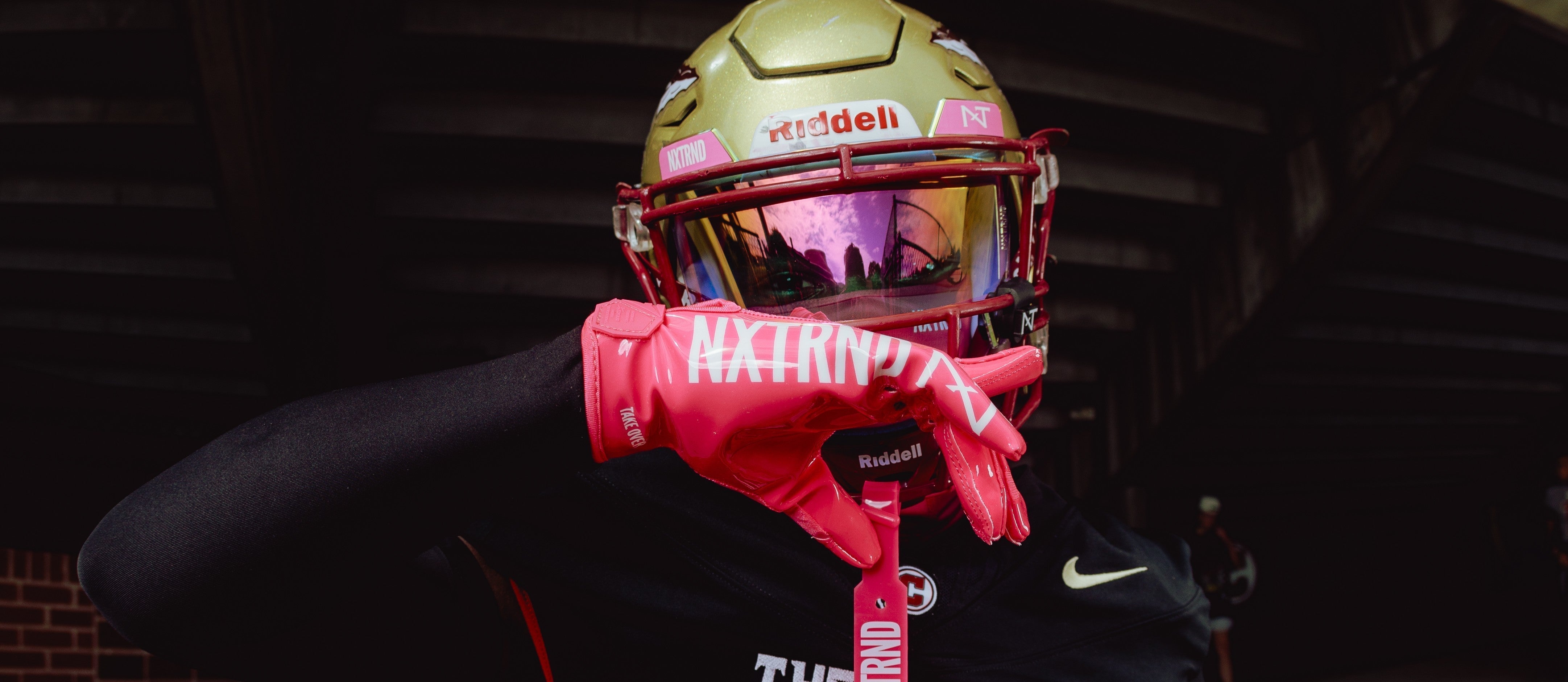 Why do Football players wear pink in October?
