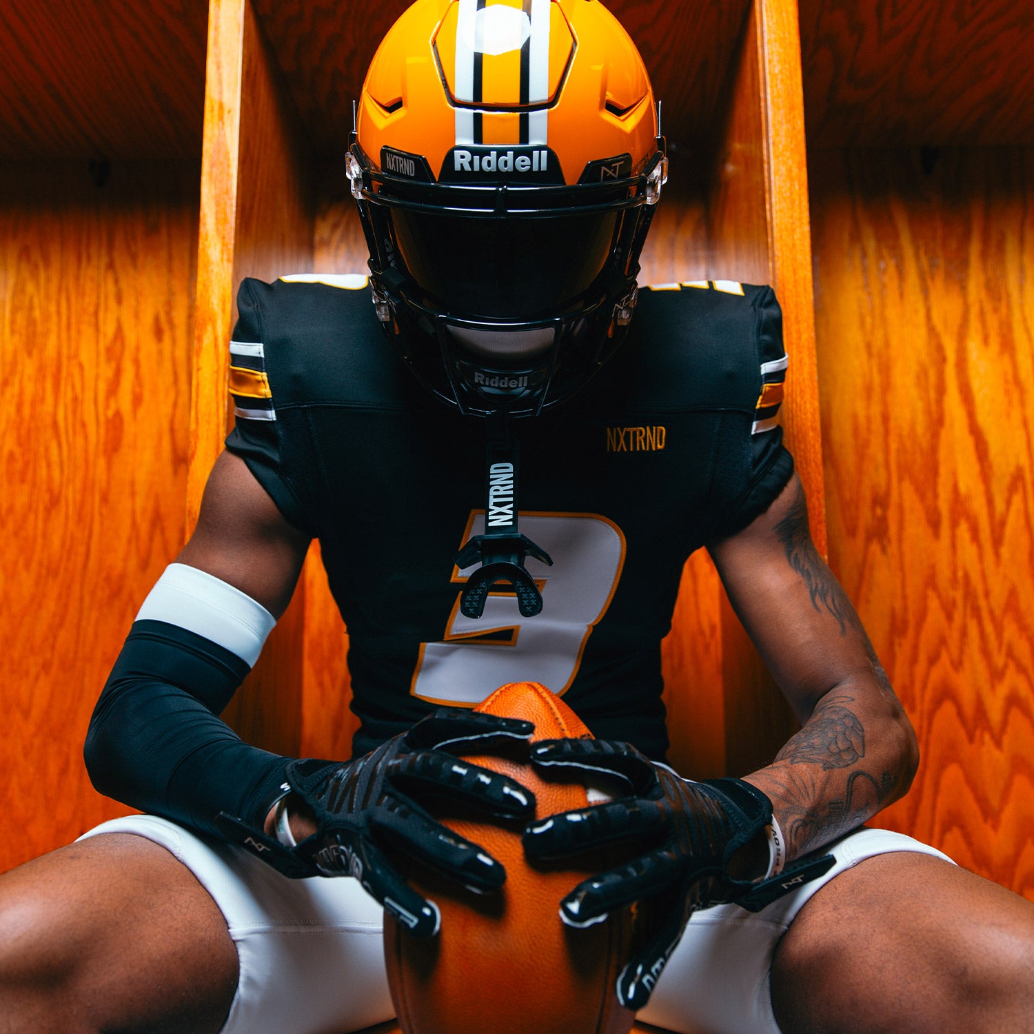 NCAA Star Football Player Luther Burden Wearing NXTRND Double Compression Arm Sleeves Black and TWO Football Mouthguard