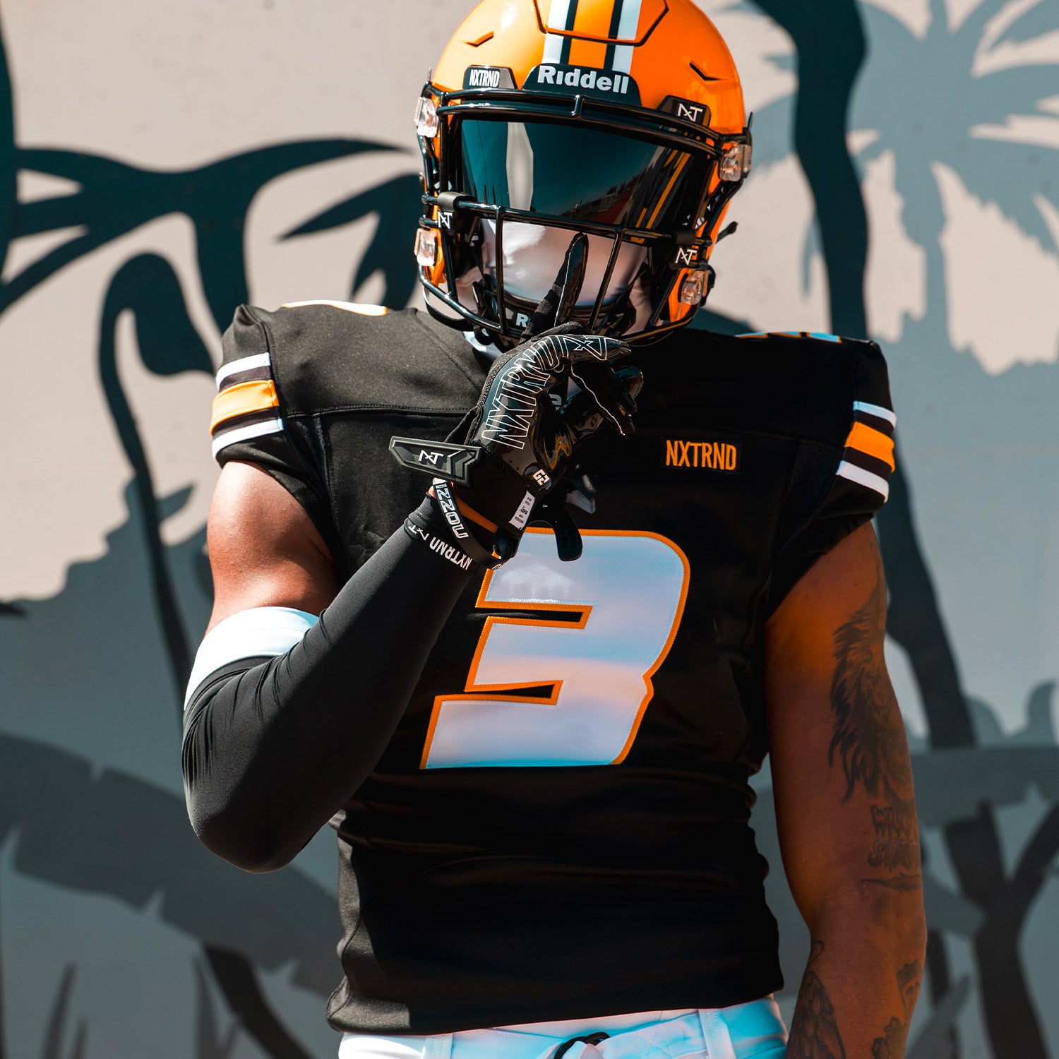NCAA Star Football Player Luther Burden Wearing NXTRND Double Compression Arm Sleeves Black and Ski Mask White