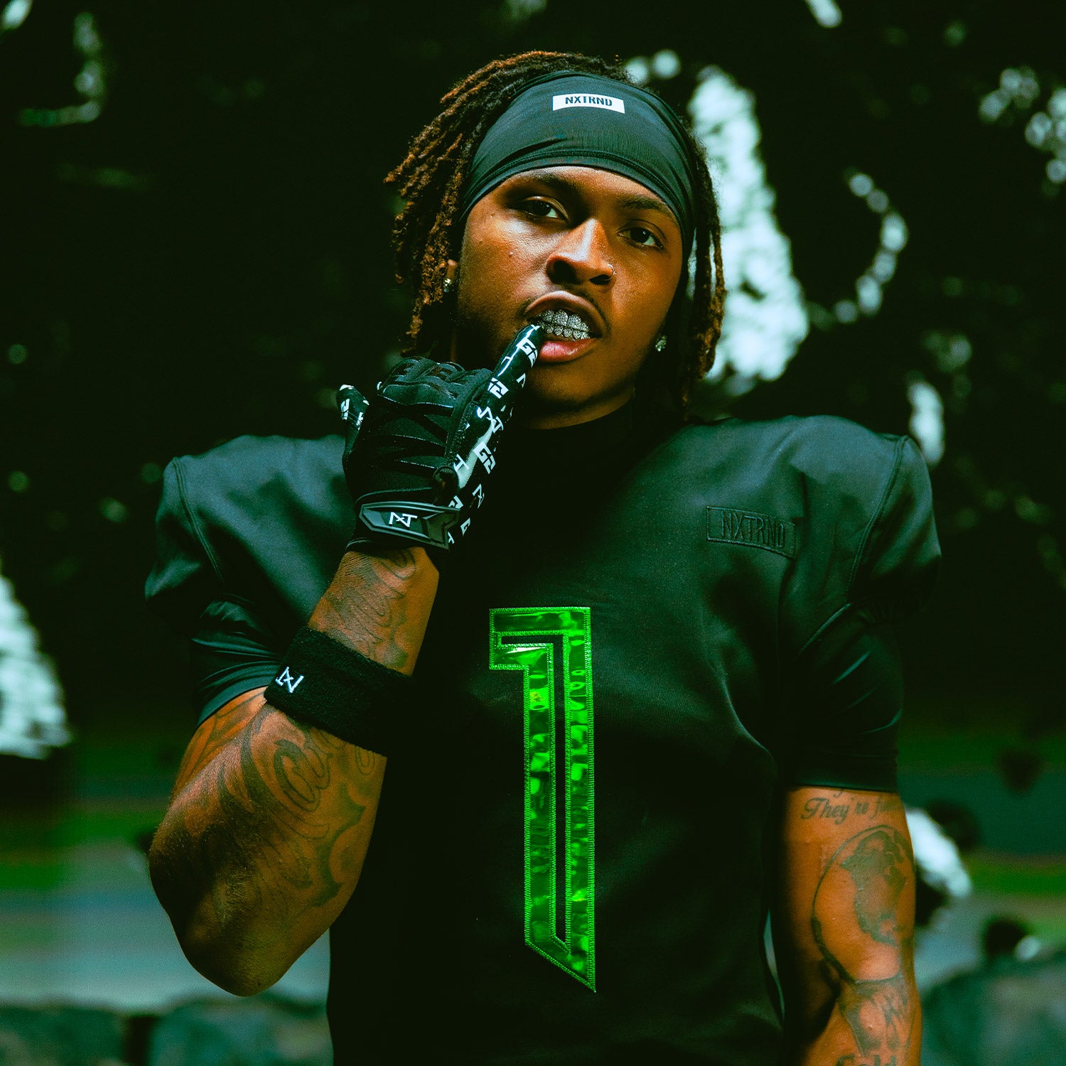 NCAA Star Dakorien Moore Wearing NXTRND G2 Pro Football Gloves Black and Football Headband Black