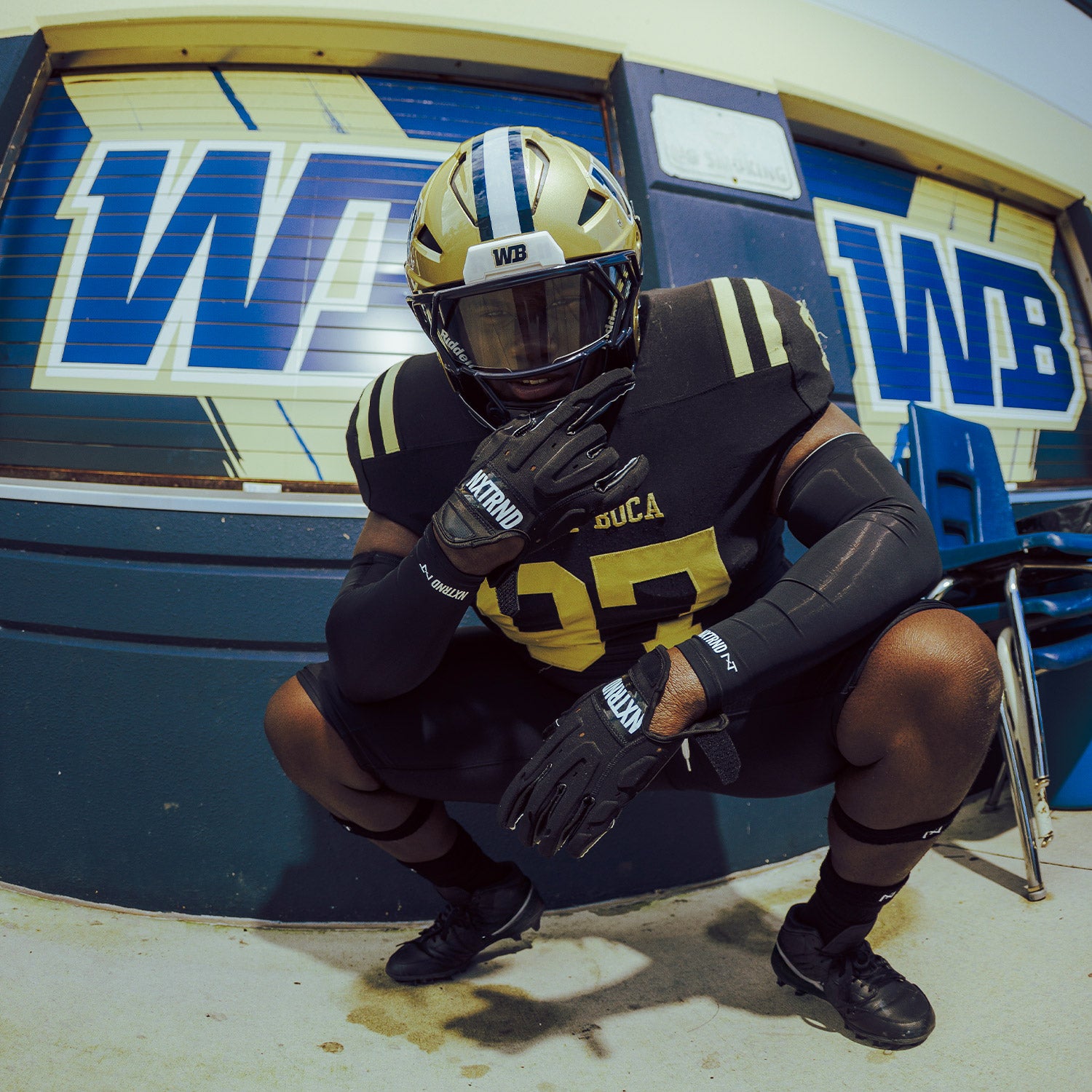 High School Football Player Wearing NXTRND G3 Pro Padded Football Gloves Black and Arm Sleeves