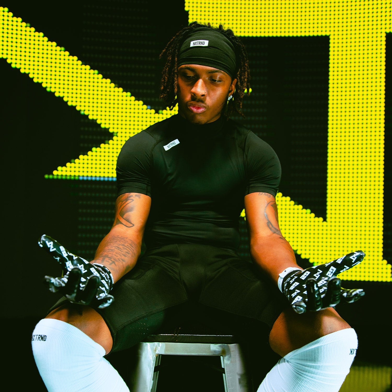 NCAA Wide Receiver Dakorien Moore Wearing Core Compression Mock Turtleneck Shirt and NXTRND G2 Football Gloves