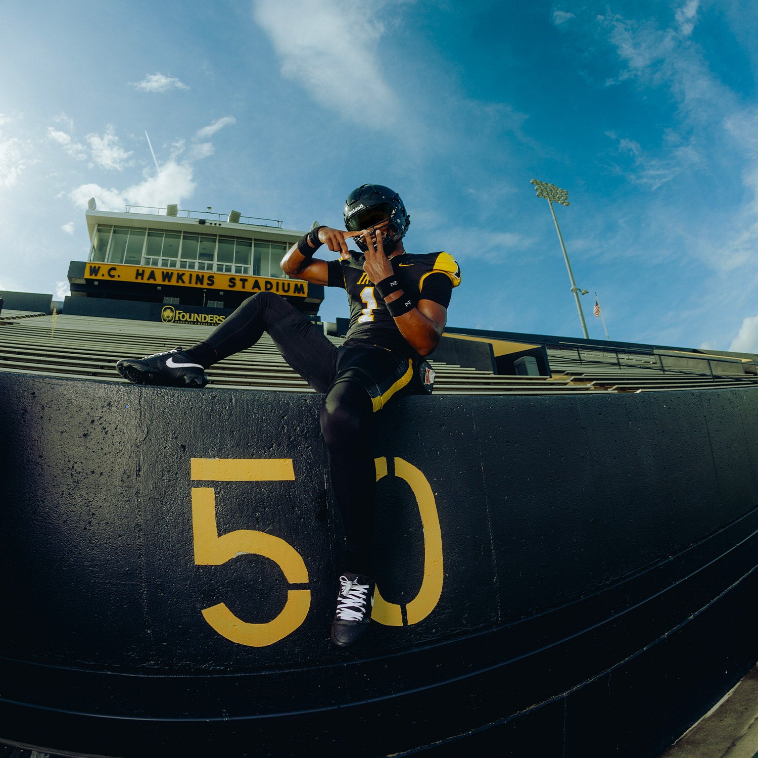 High School Football Player Wearing NXTRND Wrist Band Black and Core Compression Pants Black