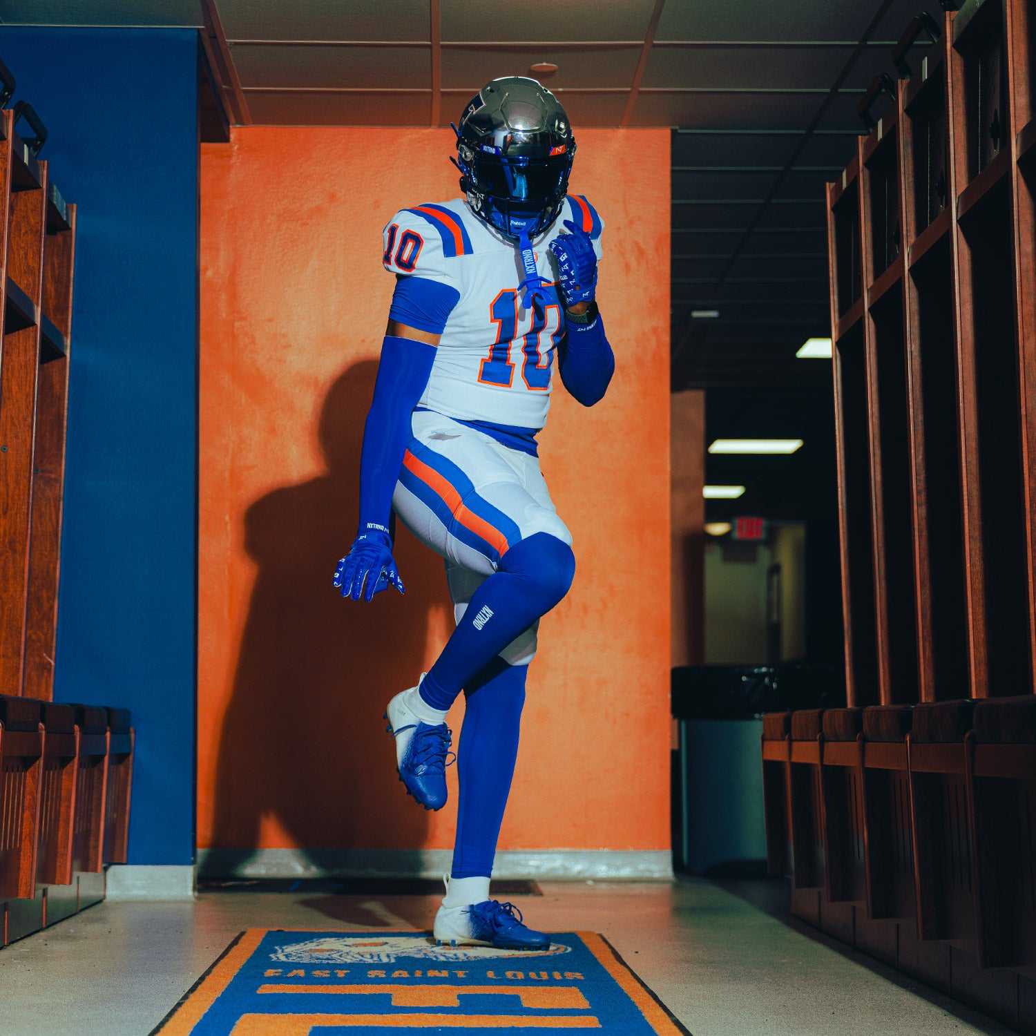 High School Football Player Wearing Core Tights Compression Pants Blue