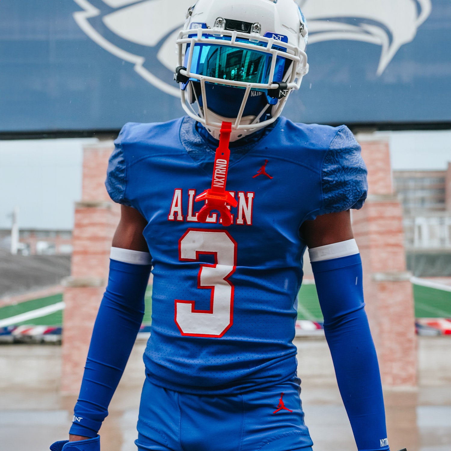 High School Football Player Wearing NXTRND Double Compression Arm Sleeves Blue and VZR3 Football Visor Blue