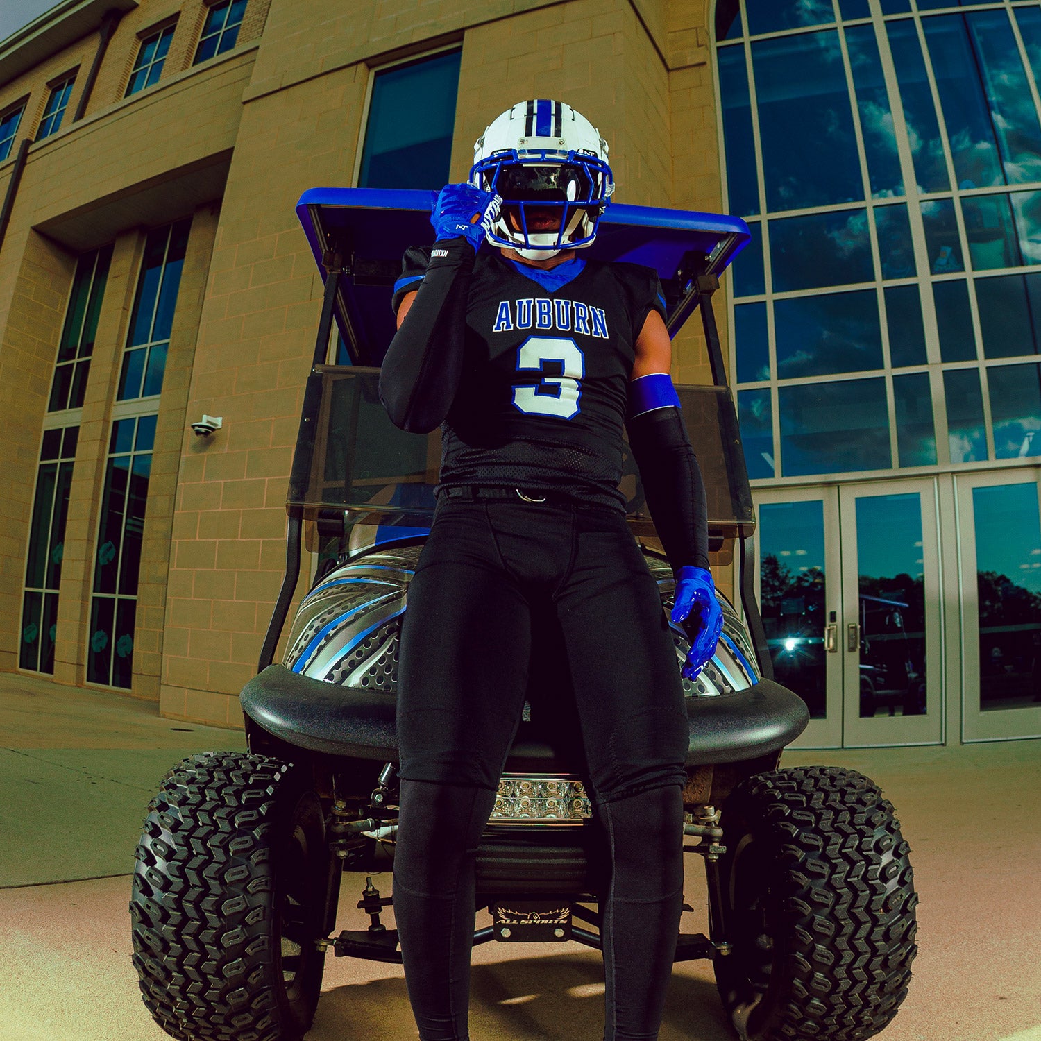 High School Football Player Wearing NXTRND G1 Pro Football Gloves Blue and Double Arm Sleeve