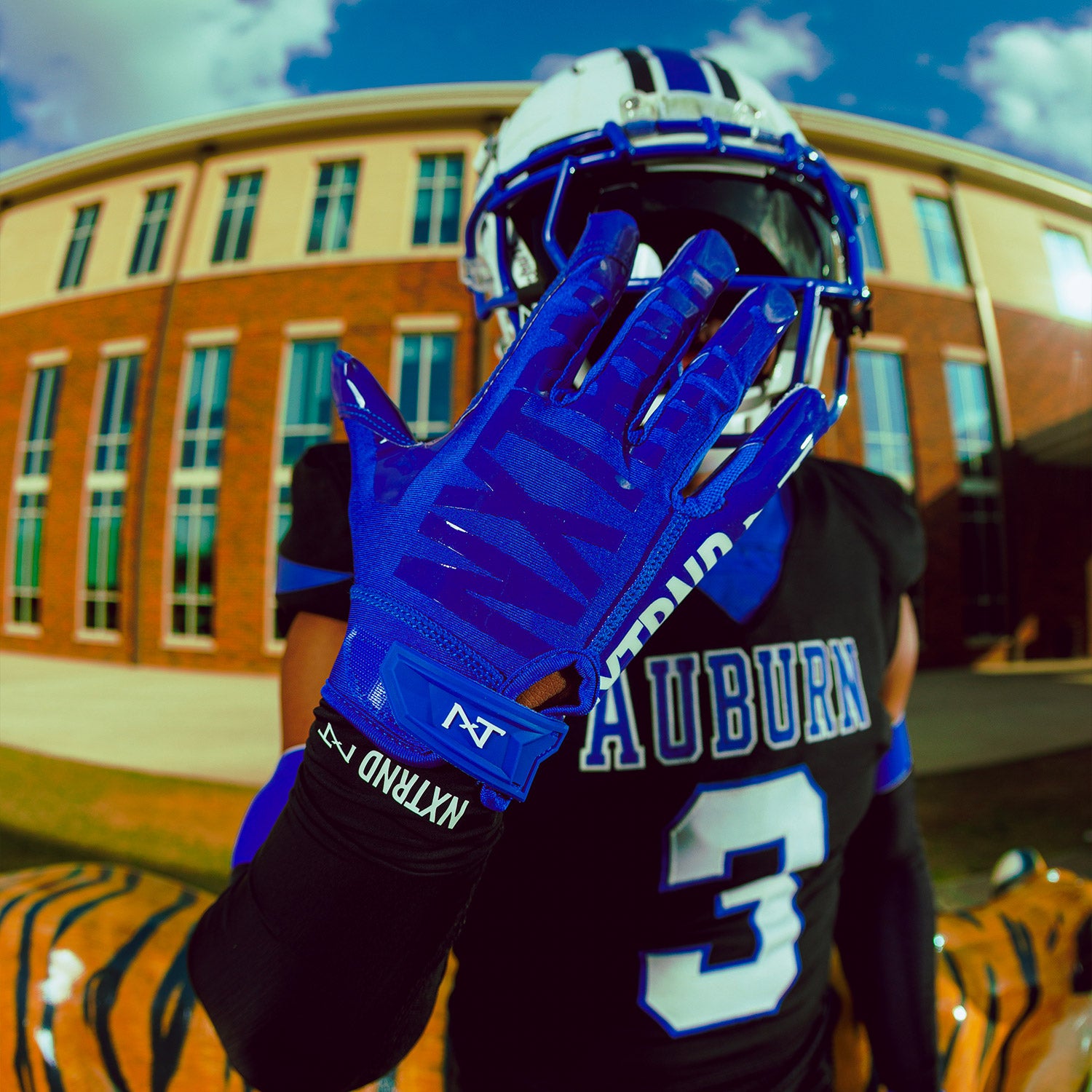 High School Football Player Wearing NXTRND G1 Pro Football Gloves Blue Close Up