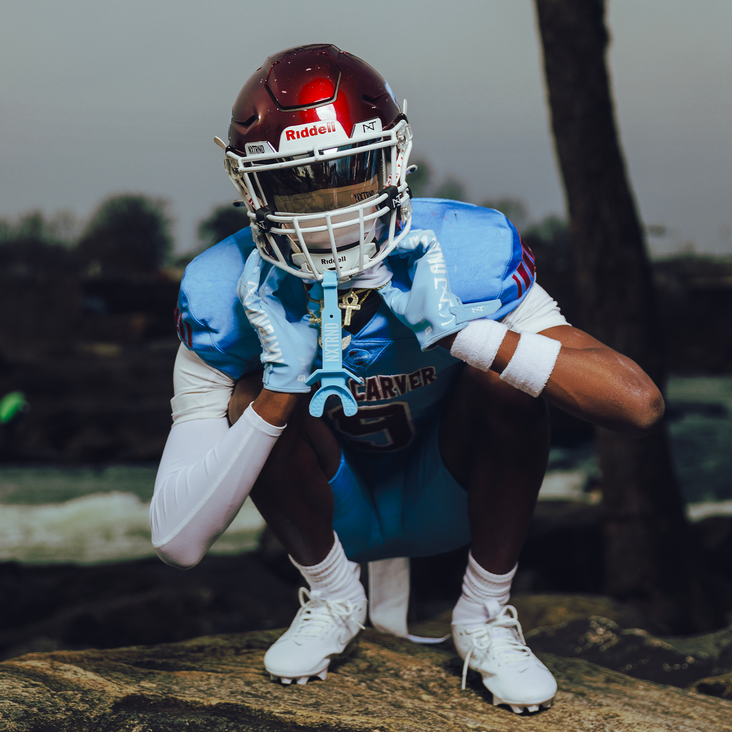 High School Football Player Wearing NXTRND G1 Pro Football Gloves Columbia Blue and Ski Mask White