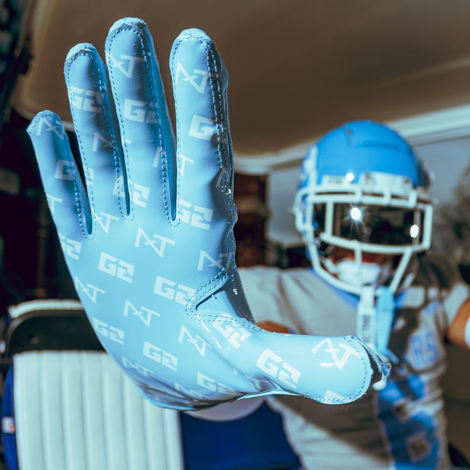 High School Player Wearing NXTRND G2 Pro Football Gloves Columbia Blue Close Up