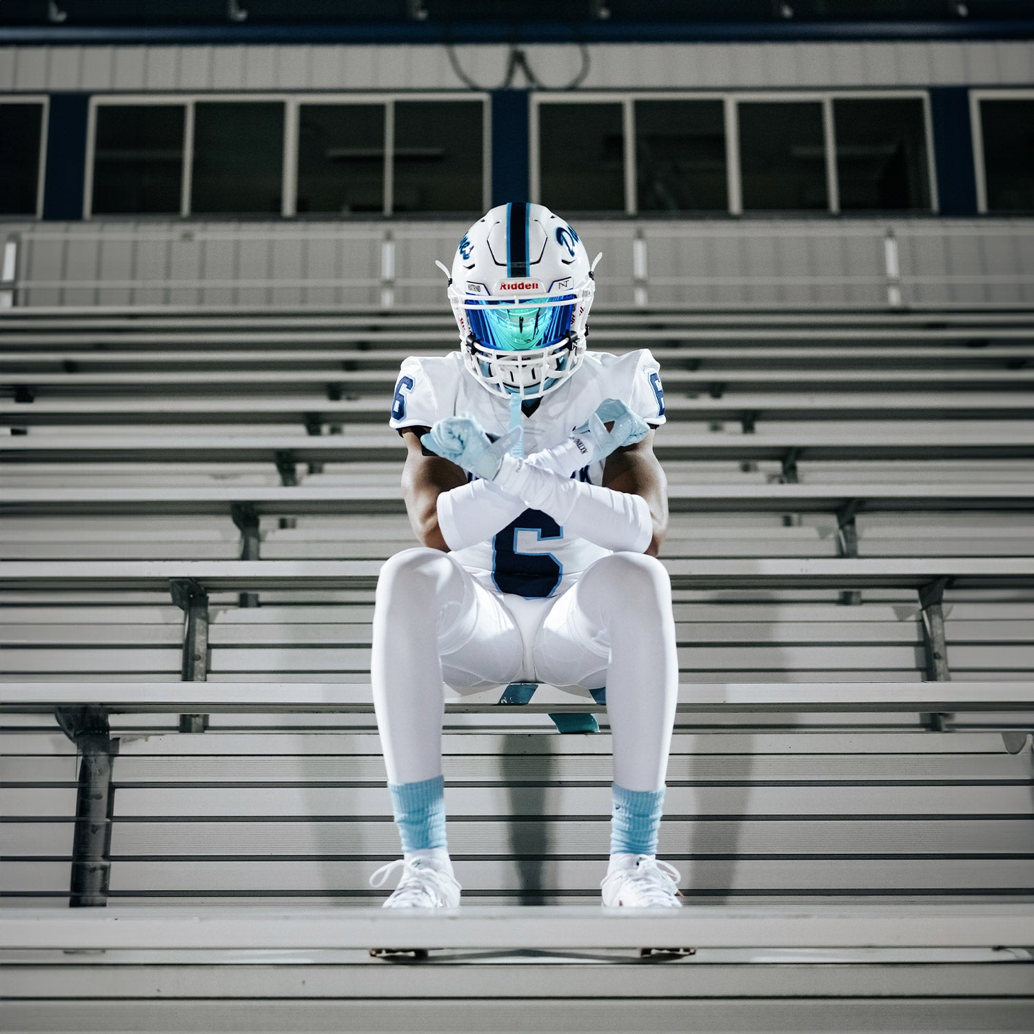 High School Football Player Wearing NXTRND Crew Mid Cut Padded Socks Columbia Blue and VZR3 Football Visor Blue