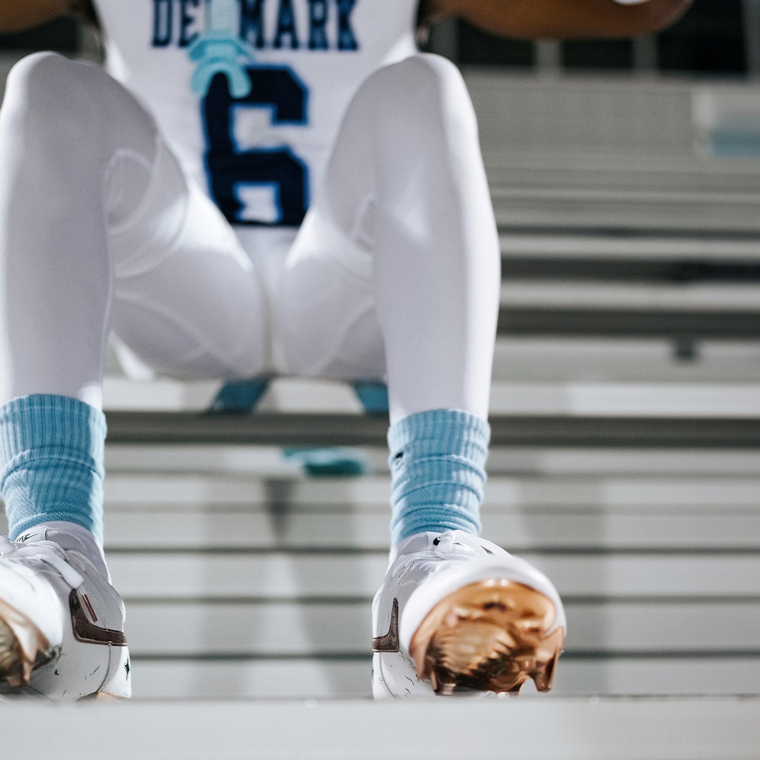 High School Football Player Wearing NXTRND Crew Mid Cut Padded Socks Columbia Blue