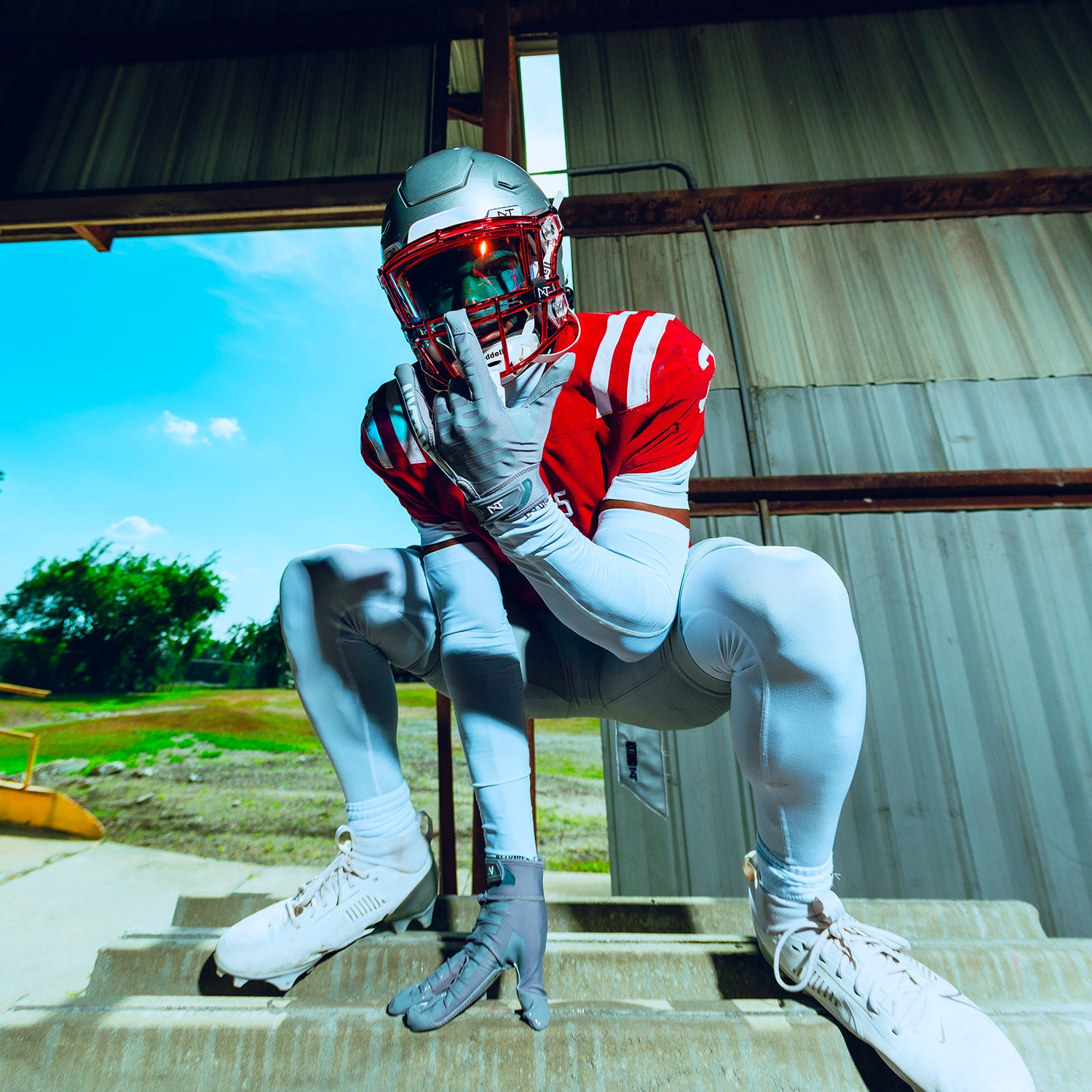 High School Football Player Wearing NXTRND G1 Pro Football Gloves Grey and Core Compression Pants White
