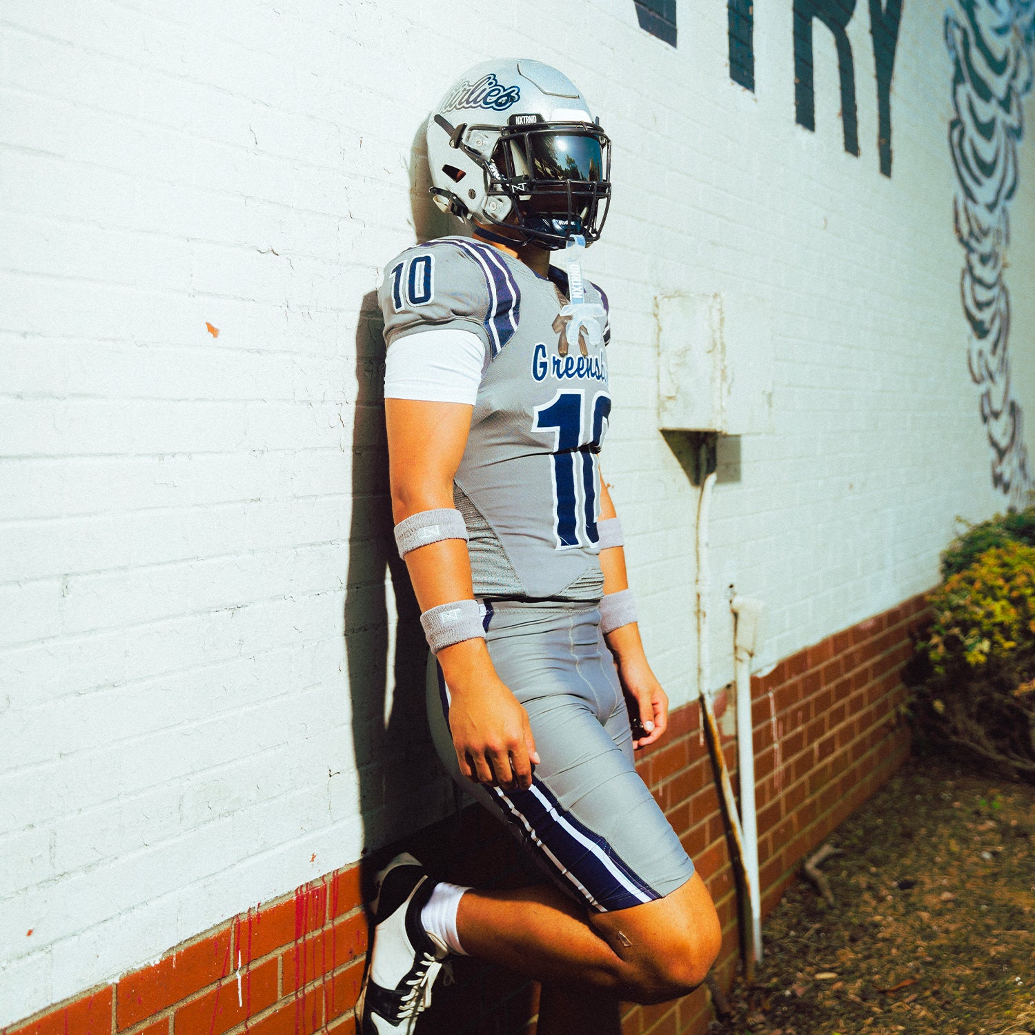 High School Football Player Wearing NXTRND Wrist Band Grey and VZR3 Football Visor Mirror