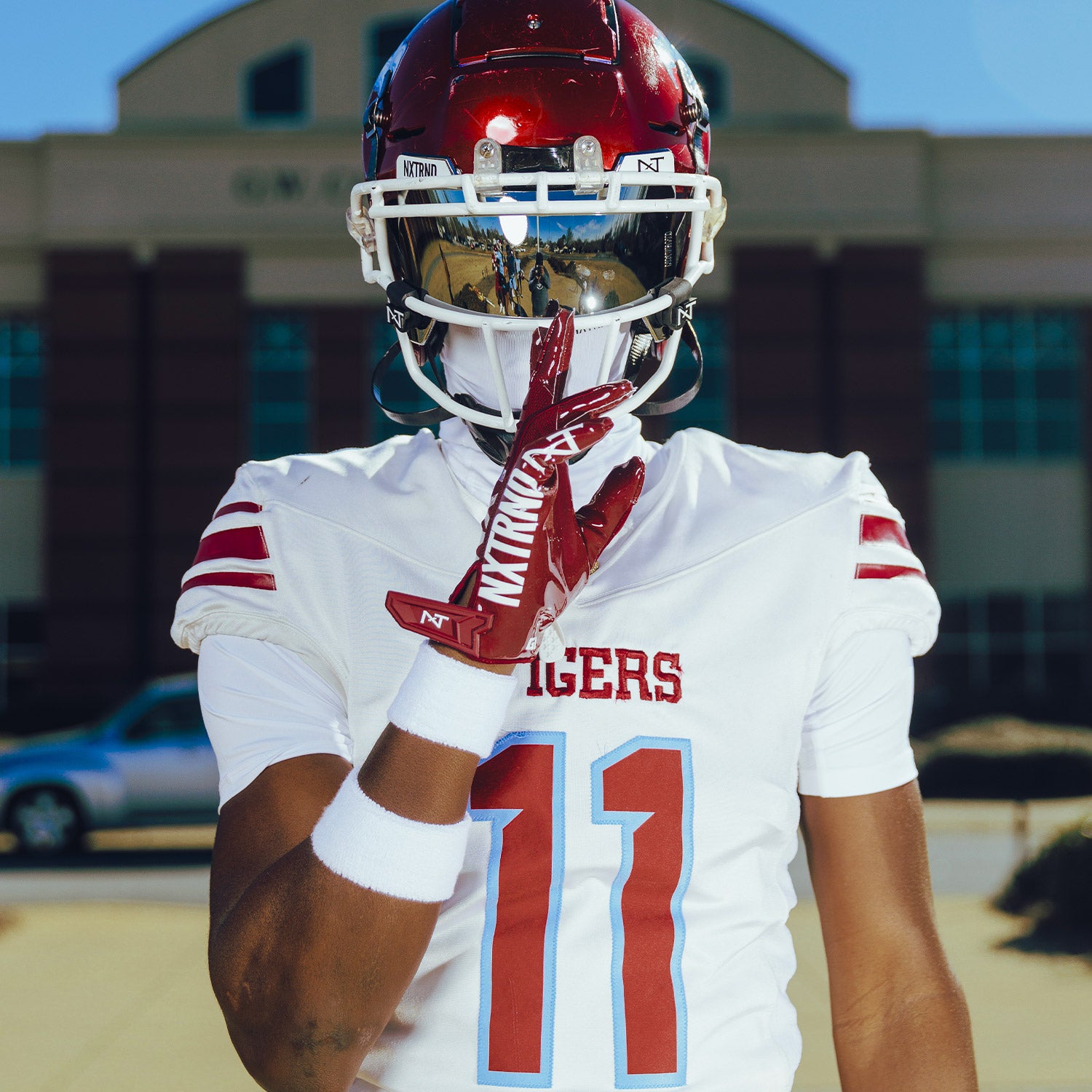 High School Football Player Wearing NXTRND G1 Pro Football Gloves Maroon and VZR3 Mirror Football Visor
