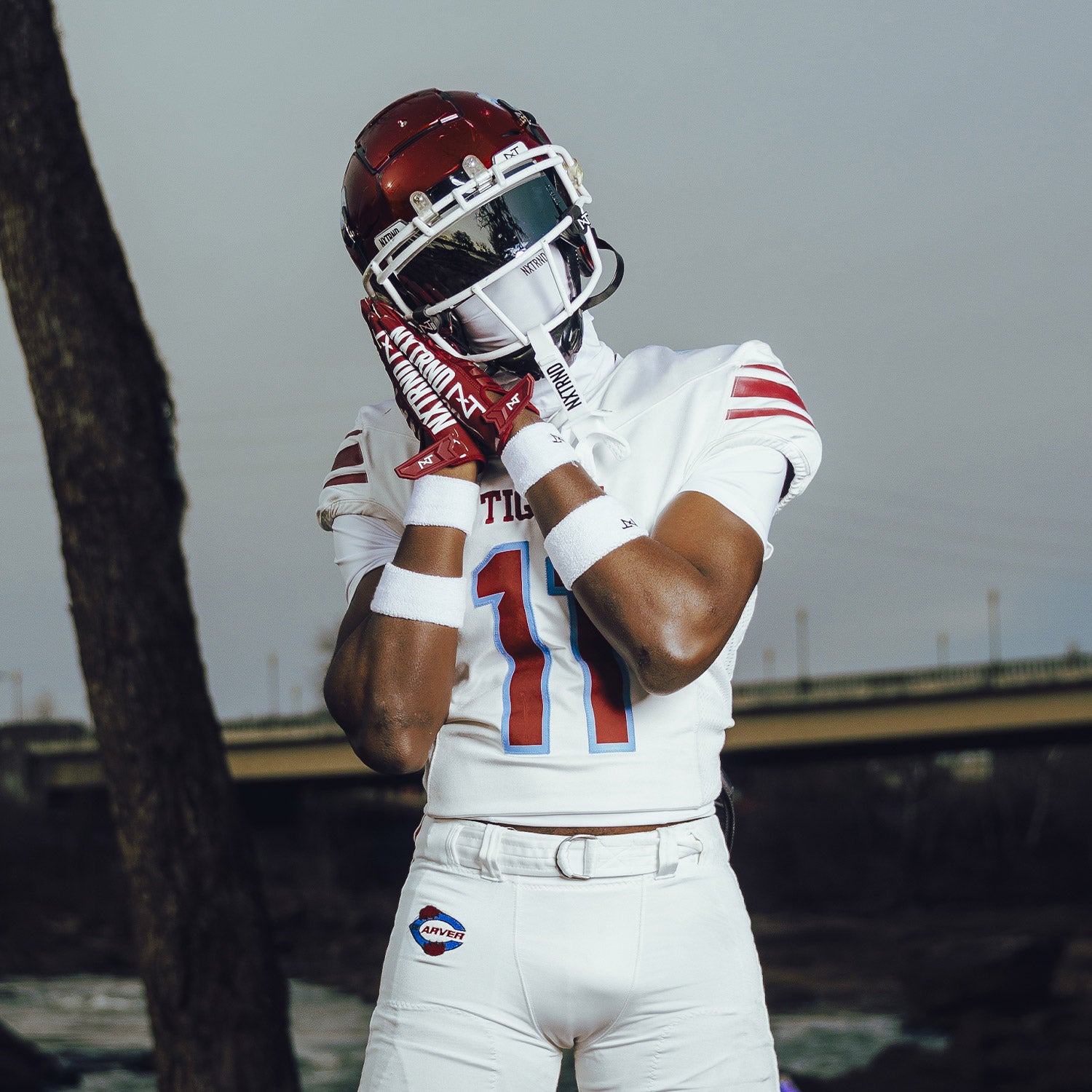High School Football Player Wearing NXTRND G1 Pro Football Gloves Maroon and Ski Mask White
