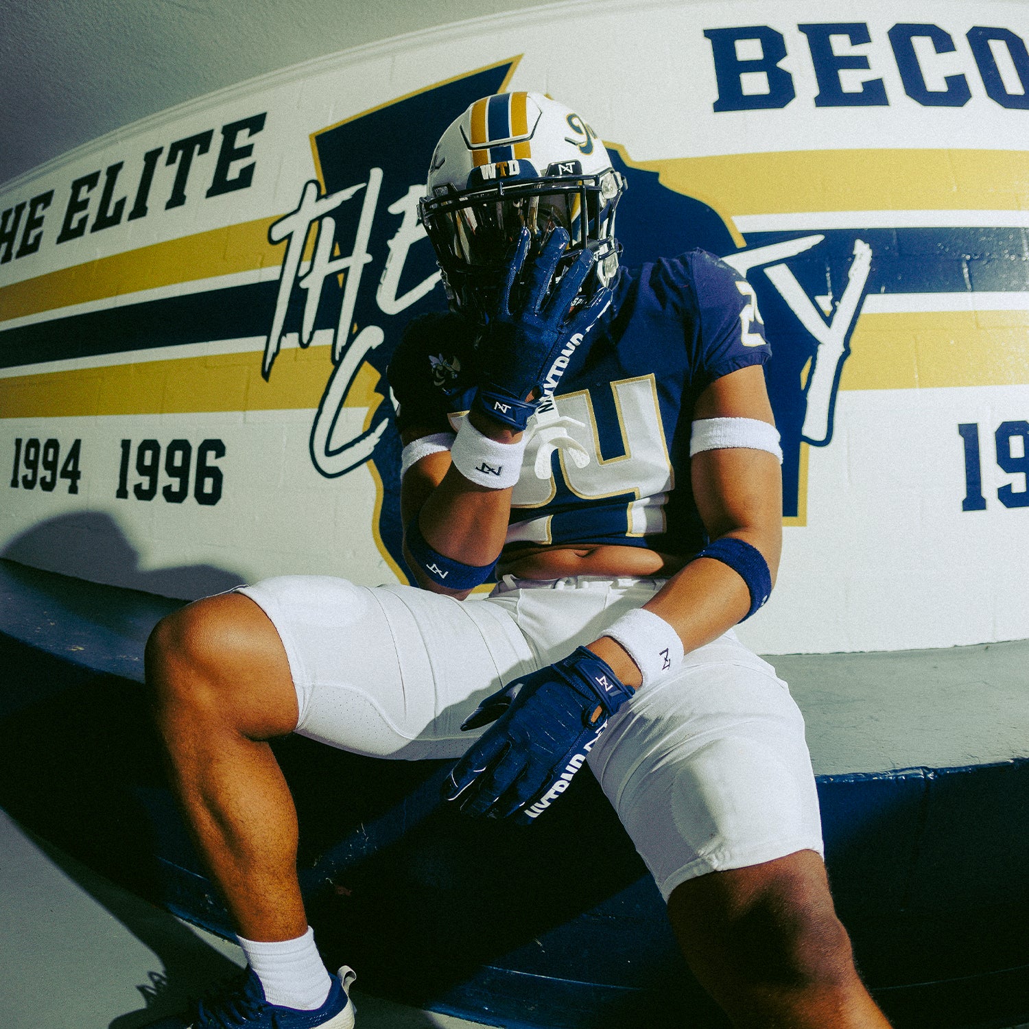 High School Football Player Wearing NXTRND G1 Pro Football Gloves Navy Blue