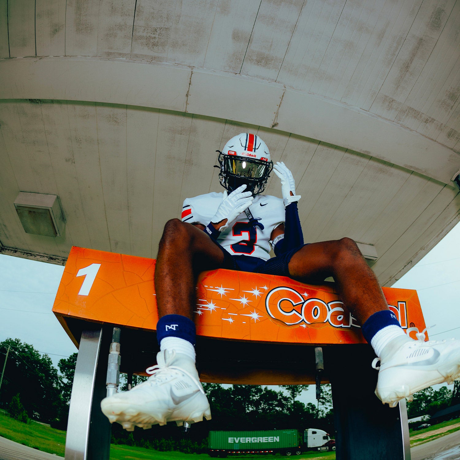 High School Football Player Wearing NXTRND Wrist Band Navy Blue and G1 Pro Football Gloves White