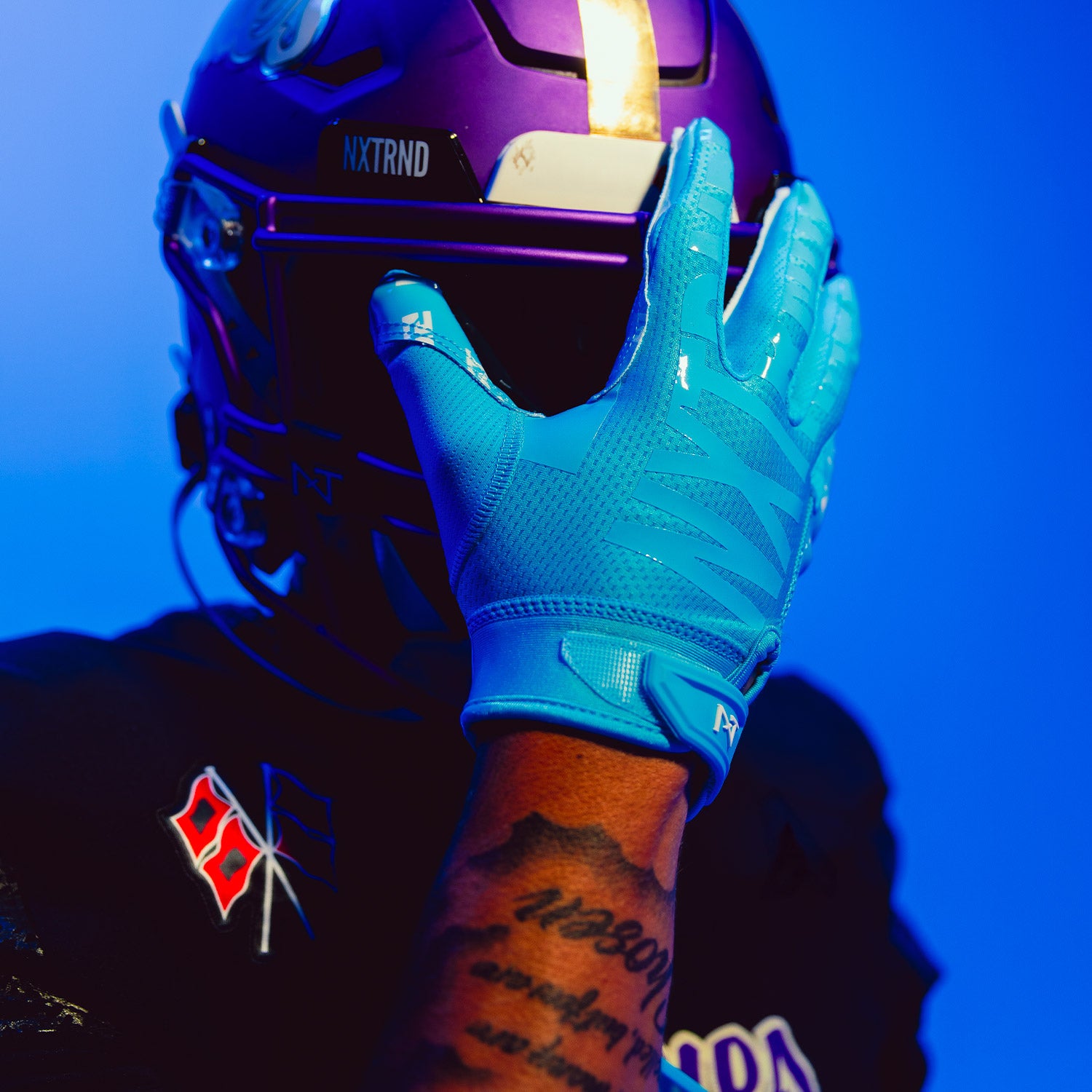 Highschool Athlete wearing NXTRND G2 Pro Football Gloves Neon Blue and VZR3 Football Visor