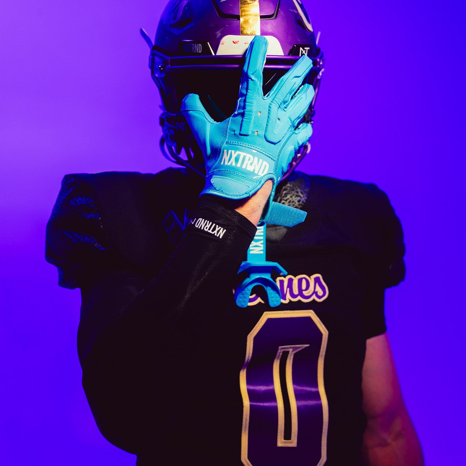 High School Football Player Wearing NXTRND G3 Pro Padded Football Gloves Neon Blue Close Up