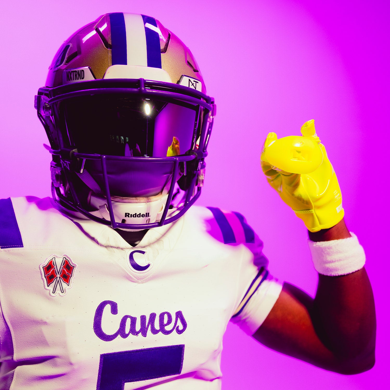 High School Football Player Wearing NXTRND ONE Strap Football Mouthguard Neon Yellow and G1 Pro Football Gloves Neon Yellow