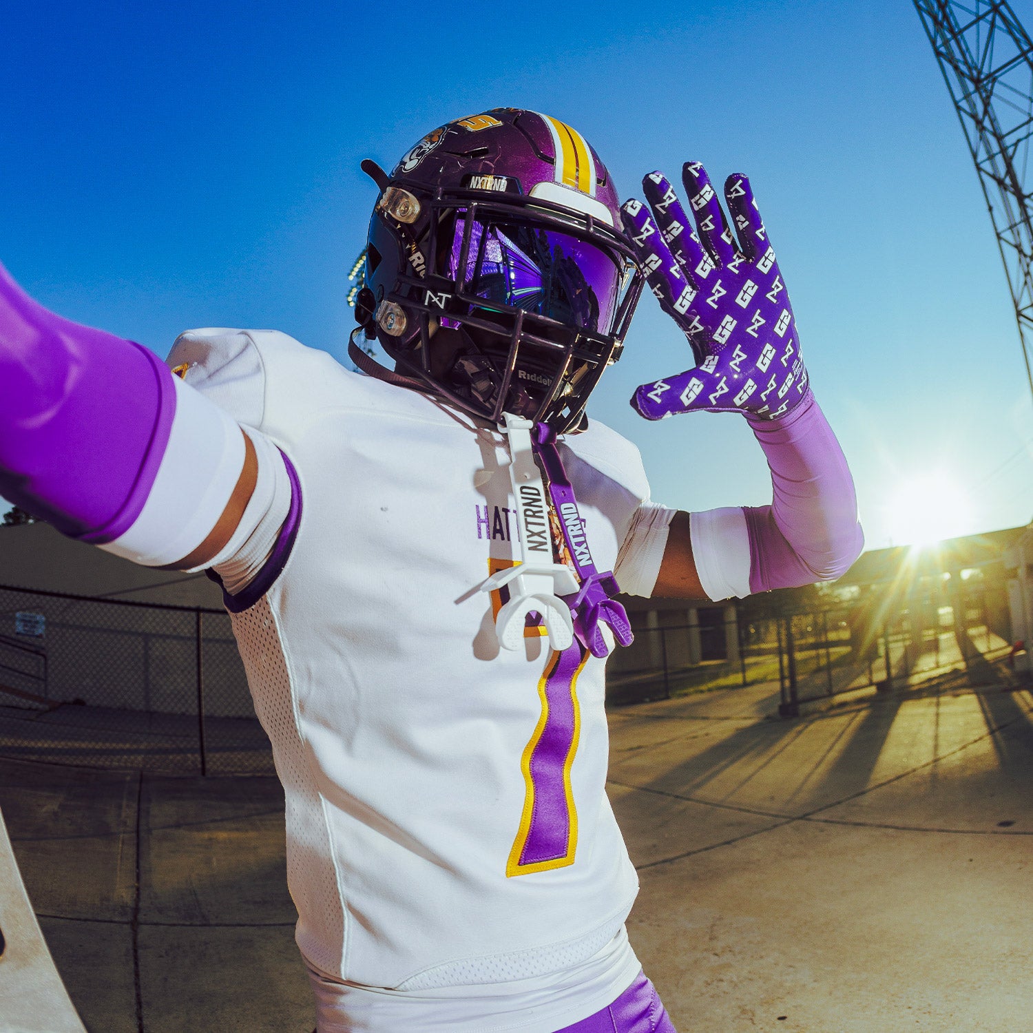 High School Football Player Wearing NXTRND G2 Pro Football Gloves Purple and Double TWO Football Mouthguards