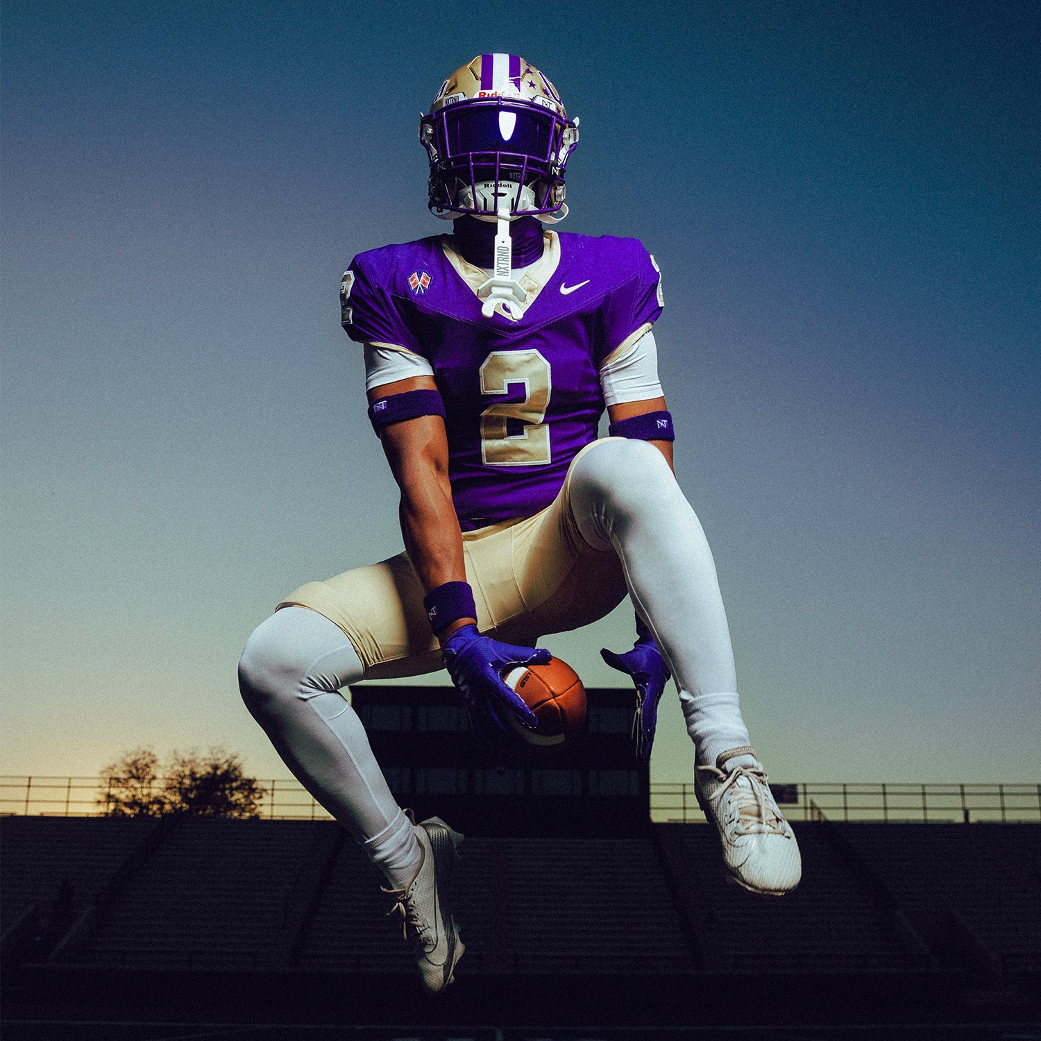 High School Football Player Wearing NXTRND Wrist Band Purple and Core Compression Pants White