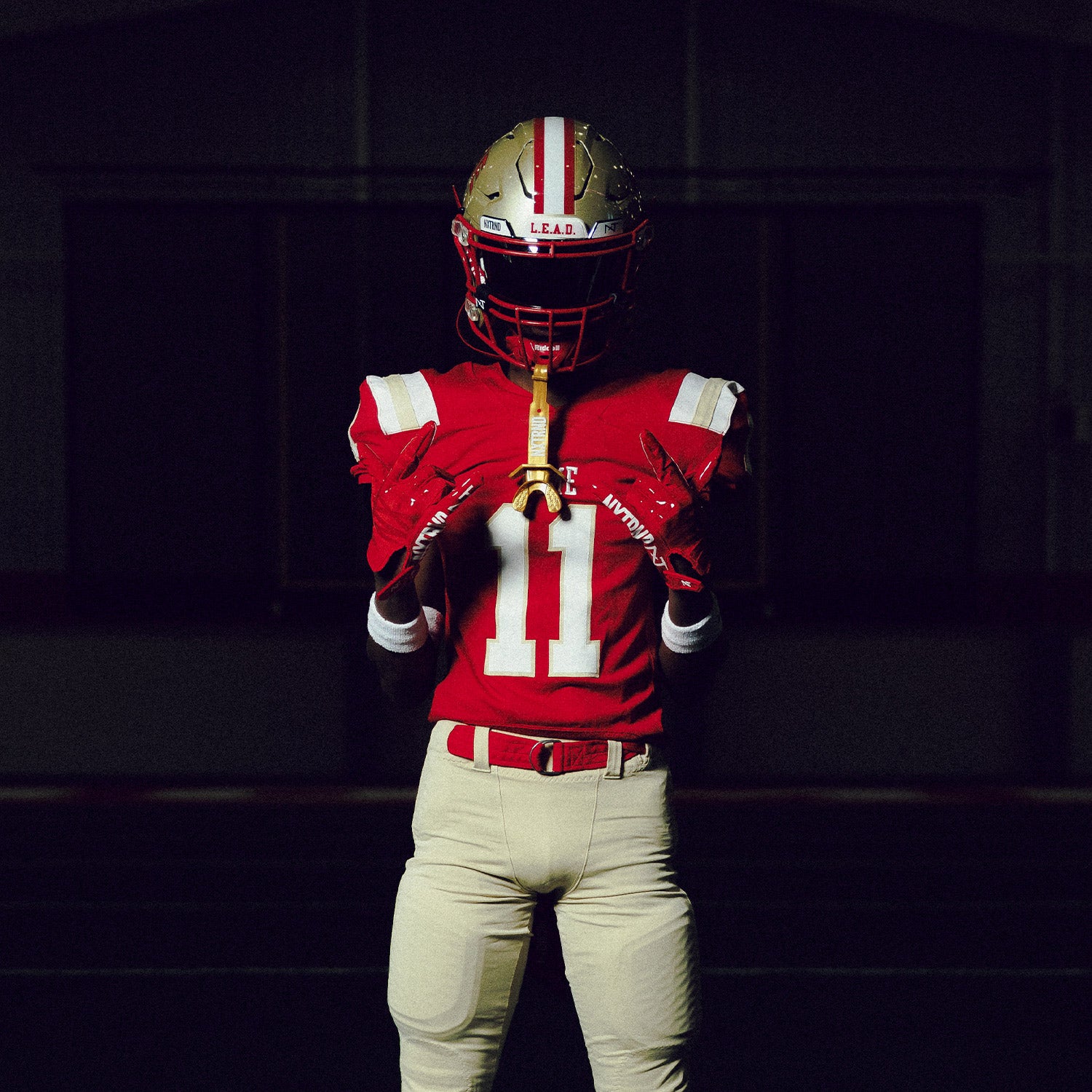 High School Player Wearing NXTRND G1 Pro Football Gloves Red and TWO Mouthguard in Gold