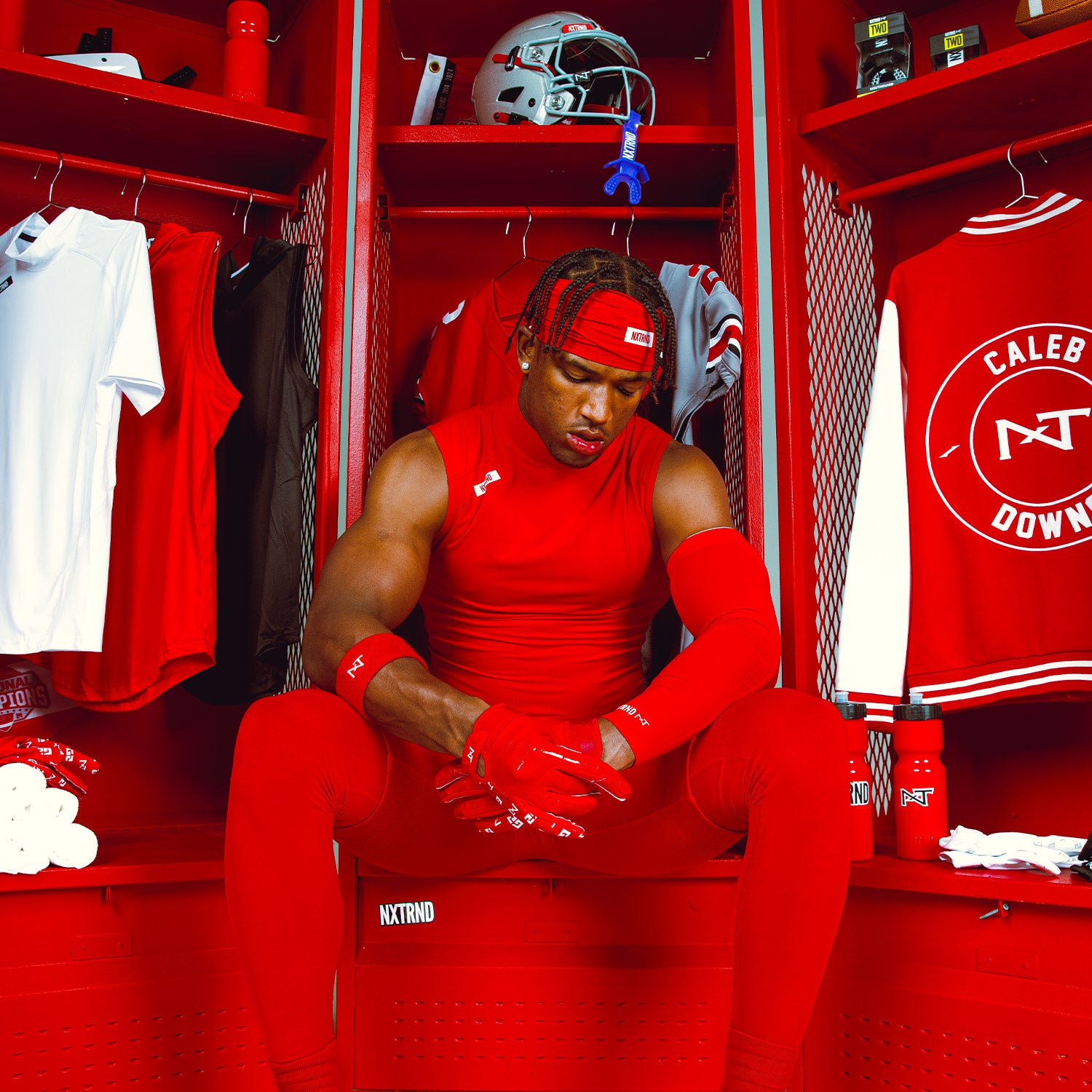 NCAA Star Football Player Caleb Downs Wearing NXTRND Wrist Band Red and Core Compression Mock Turtleneck Shirt