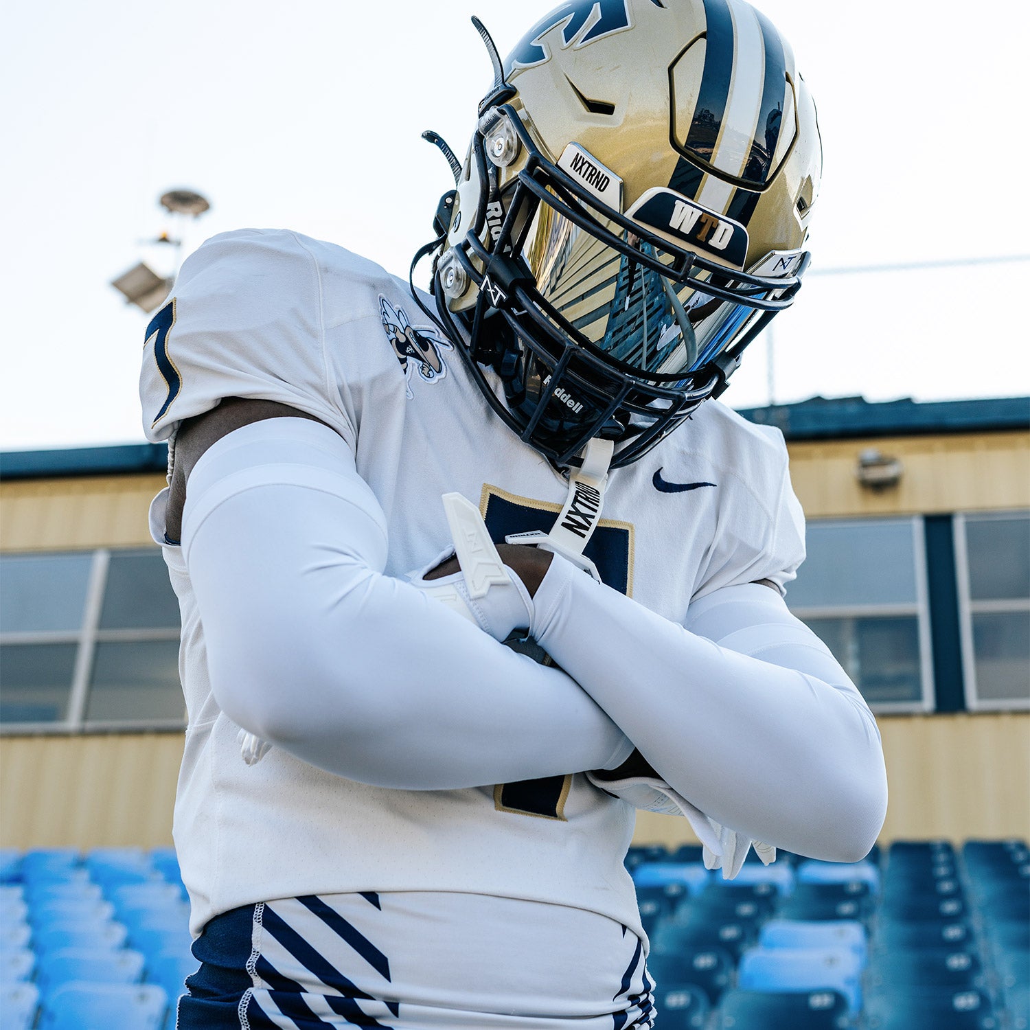 High School Football Player Wearing NXTRND Double Compression Arm Sleeves White and VZR3 Football Visor Mirror
