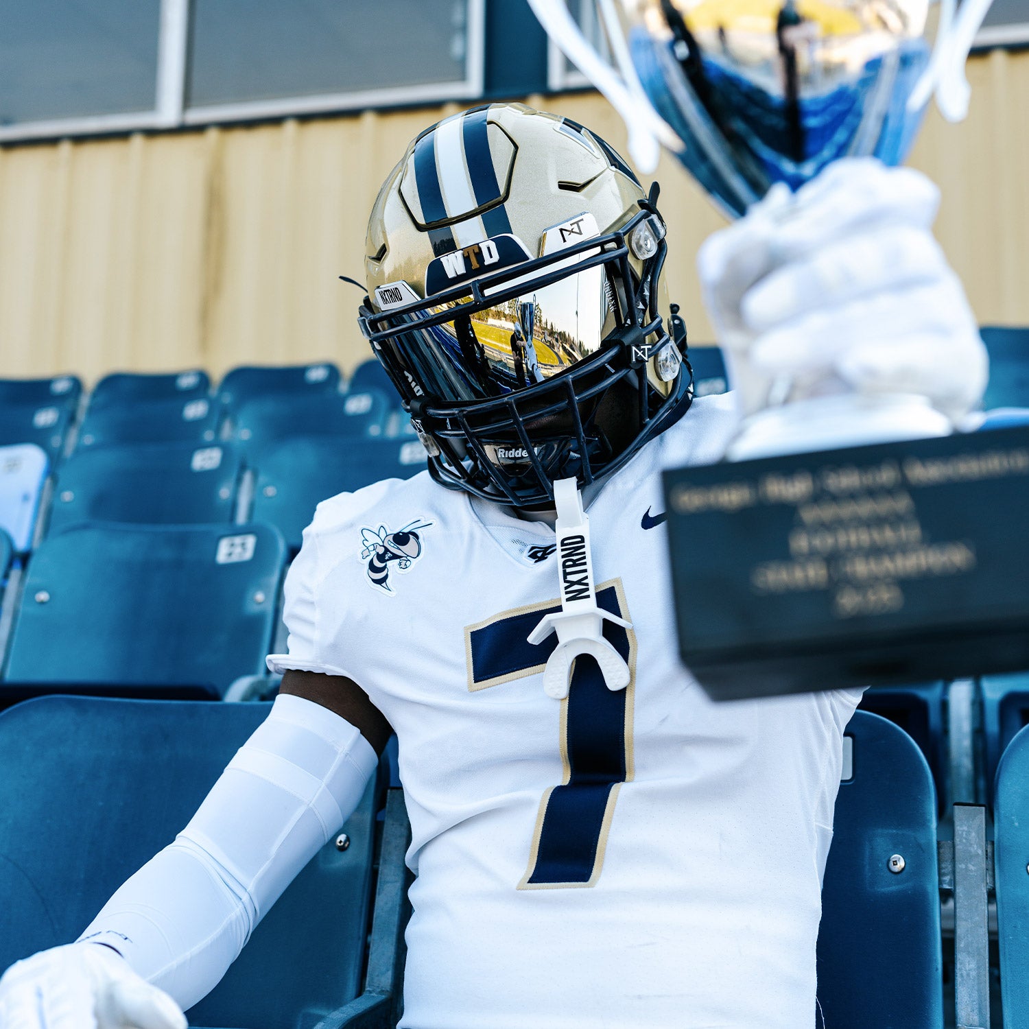 High School Football Player Wearing NXTRND Double Compression Arm Sleeves White and TWO Football Mouthguard White