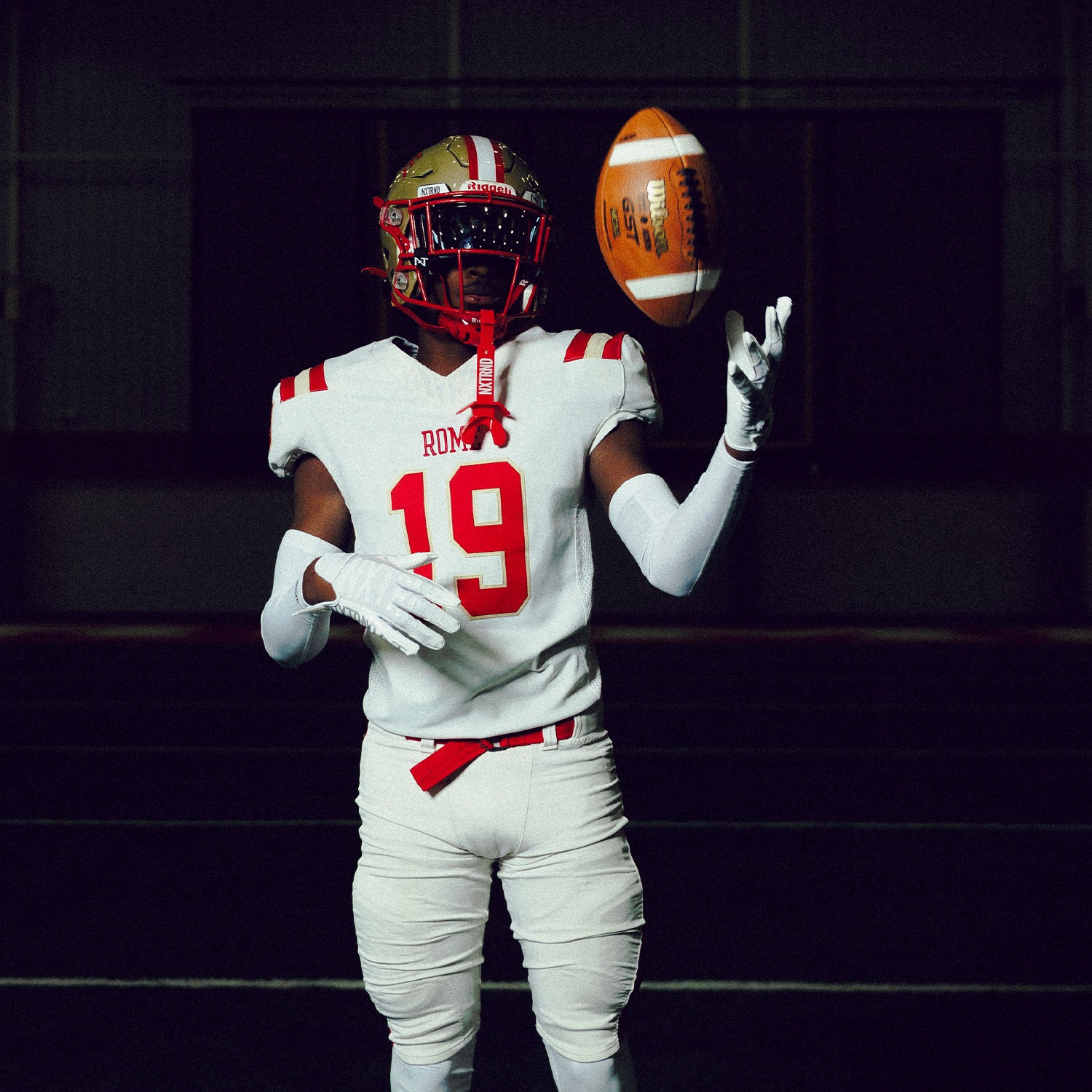High School Football Athlete Wearing NXTRND G1 Pro Football Gloves White and TWO Mouthguard in Red