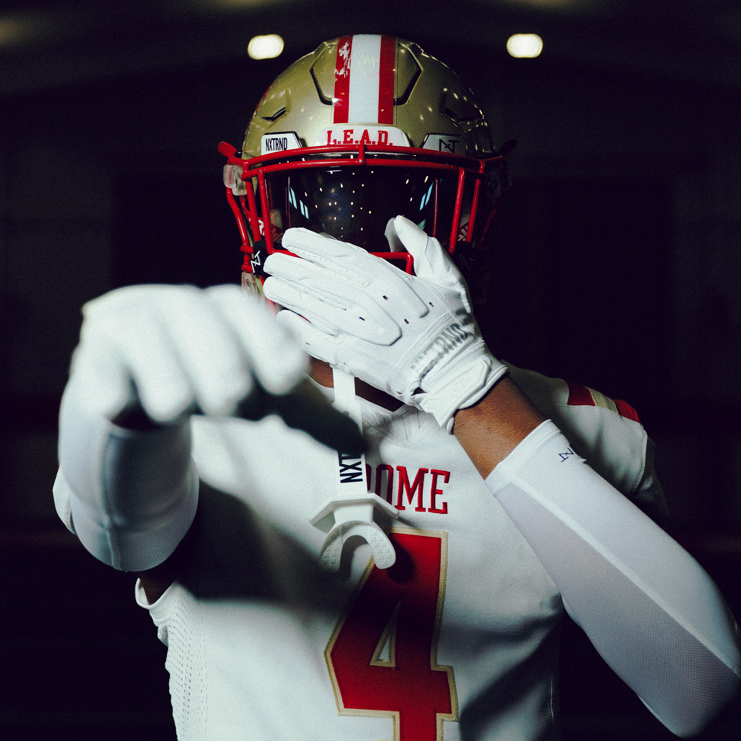 High School Football Player Wearing NXTRND G3 Pro Padded Football Gloves White and VZR3 Football Visor Black