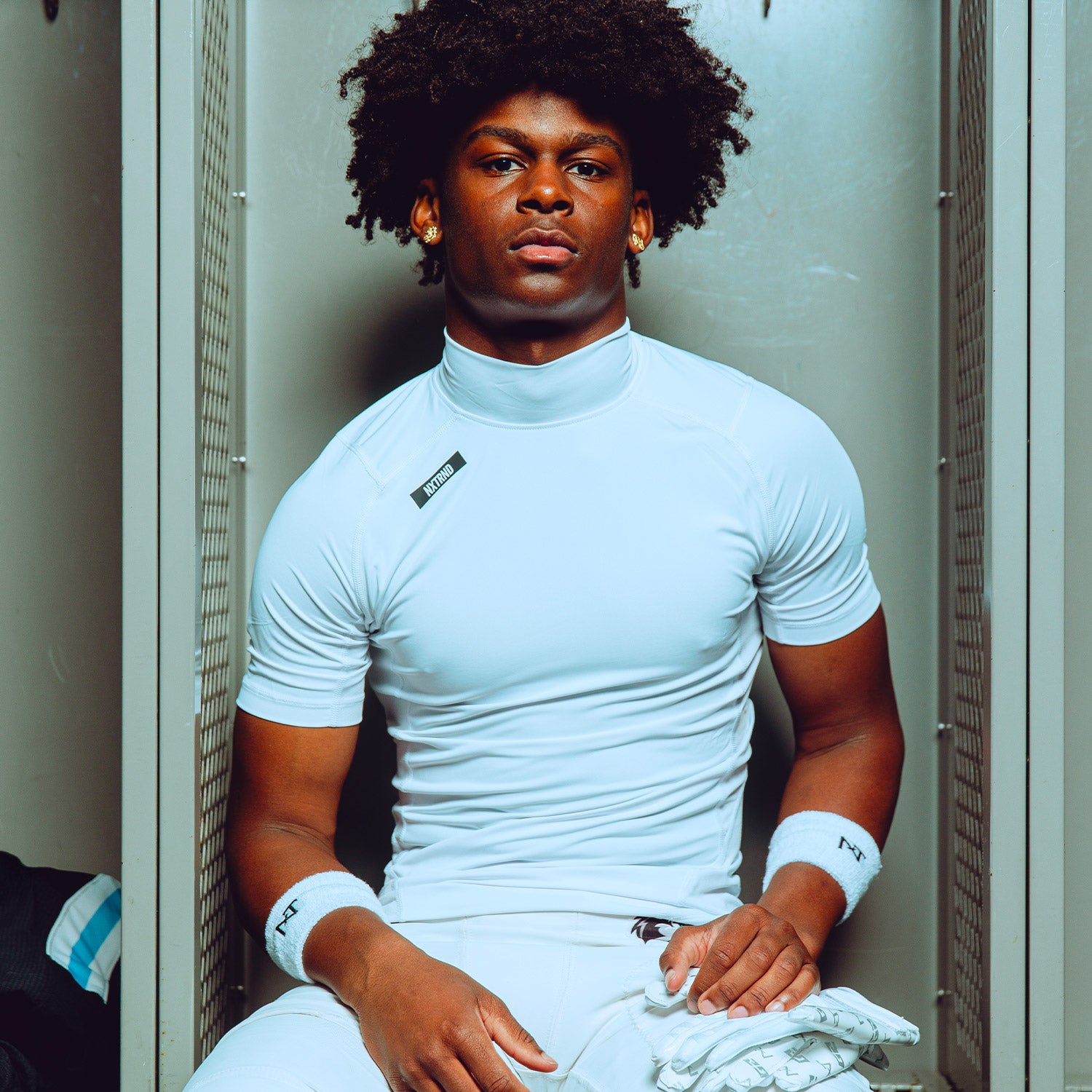High School Football Player Wearing Core Short Sleeve Compression Mock Turtleneck Shirt White