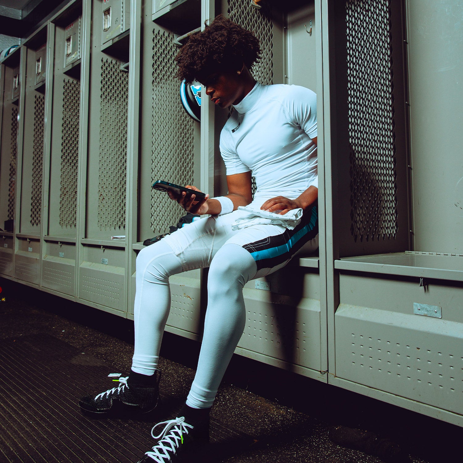 High School Athlete in Locker Room Wearing Core Short Sleeve Compression Mock Turtleneck Shirt White
