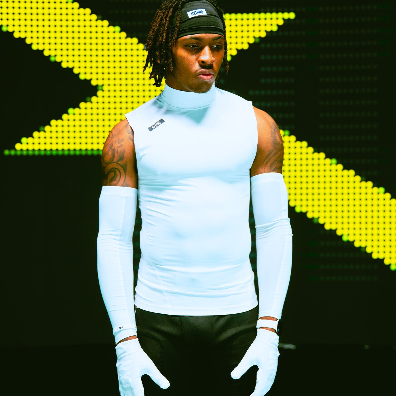 Dakorien Moore Wearing Core Sleeveless Compression Mock Neck White