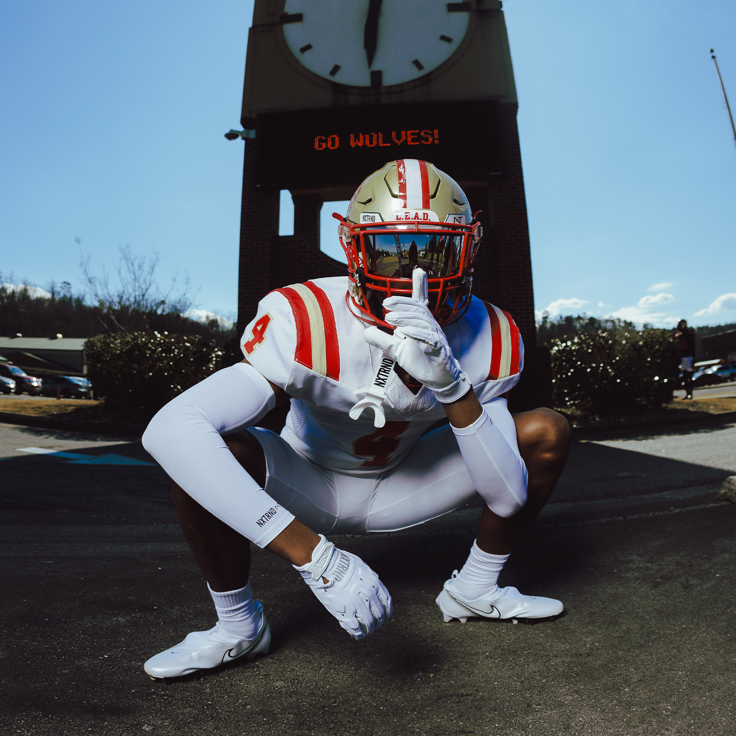High School Football Player Outside Wearing NXTRND G3 Pro Padded Football Gloves White and VZR3 Football Visor Black