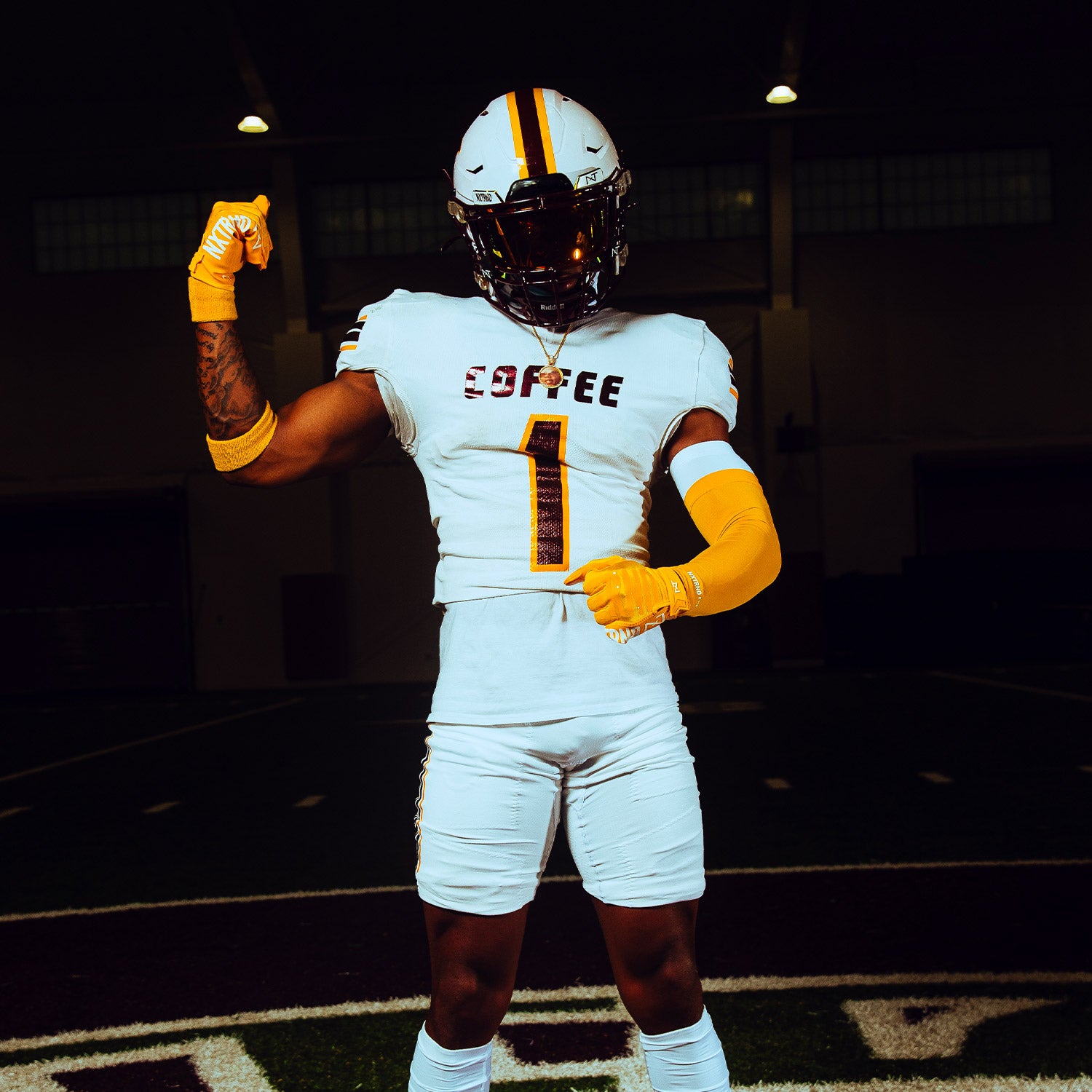 High School Football Player Wearing NXTRND Double Layer Compression Arm Sleeve Yellow and VZR3 Football Visor Gold
