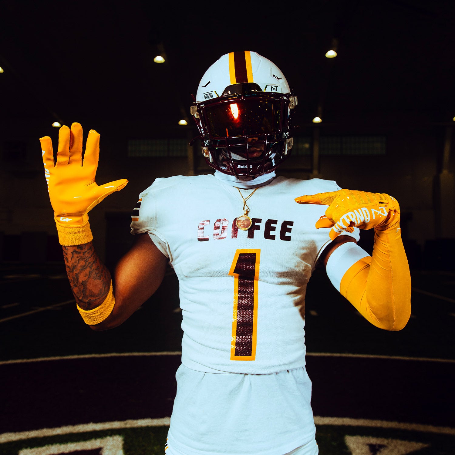 High School Football Player Wearing NXTRND G1 Pro Football Gloves Yellow And Double Arm Sleeve