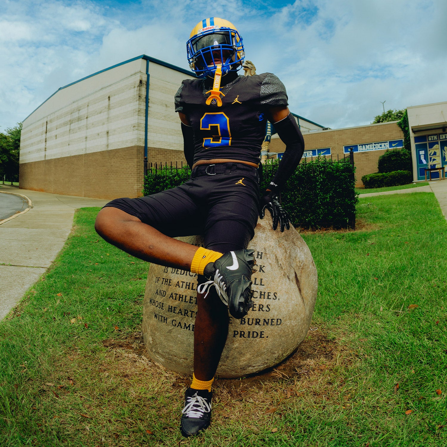 High School Football Player Wearing NXTRND Crew Mid Cut Padded Socks Yellow and TWO Football Mouthguard Yellow